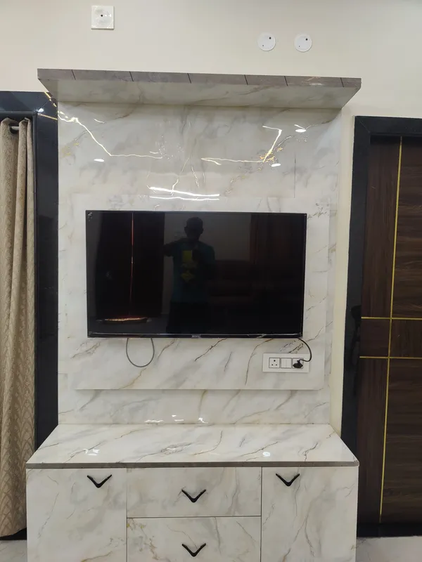 Spacious living area with TV at Vaibhavam